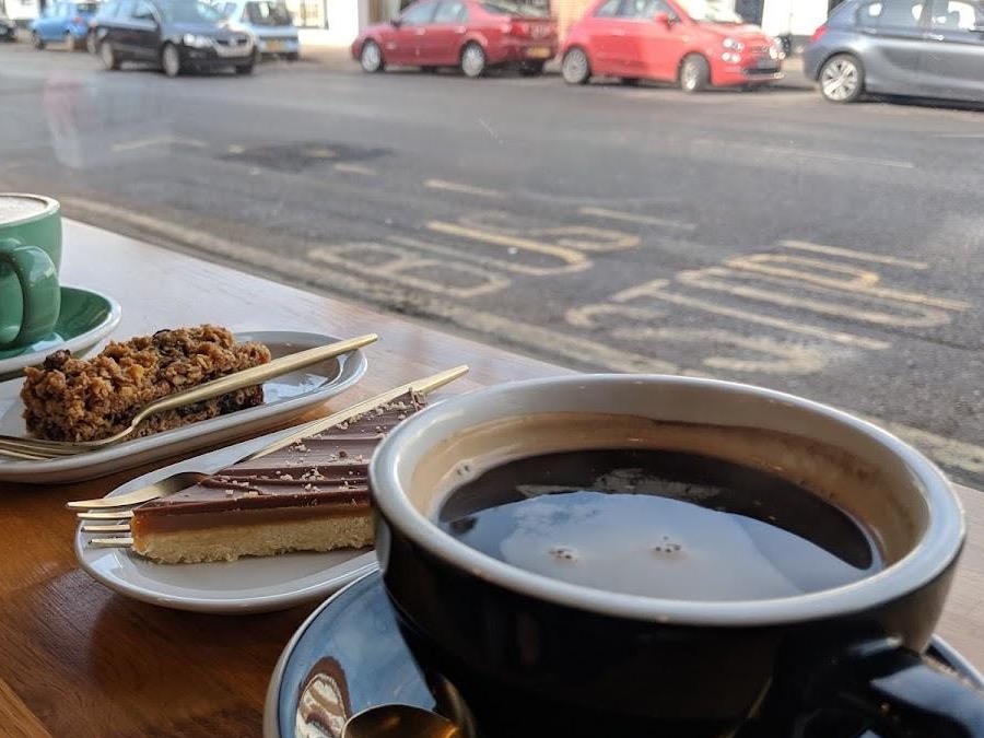 Berries Coffee window table with coffee and cakes