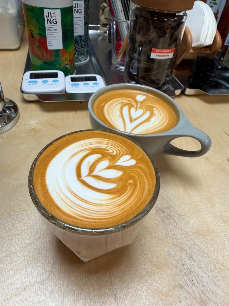 Specialty coffee with latte art at Berries Coffee TG Gym